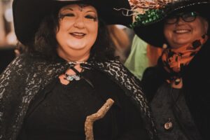 Two women dressed in witches costume at Monster Mash
